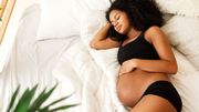 Pregnant woman sleeping in bedroom at home Pregnant woman sleeping in bedroom at home