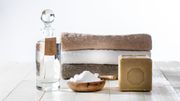Sustainable cleaning laundry with chic homemade detergents on wooden background Sustainable cleaning laundry with chic homemade detergents on wooden background