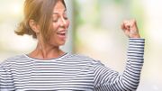 Middle age senior hispanic woman over isolated background showing arms muscles smiling proud. Fitness concept. Middle age senior hispanic woman over isolated background showing arms muscles smiling proud. Fitness concept.