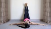 Yoga woman feet up relaxing on wall Yoga woman feet up relaxing on wall