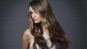 Studio portrait of young woman with long brown hair Studio portrait of young woman with long brown hair